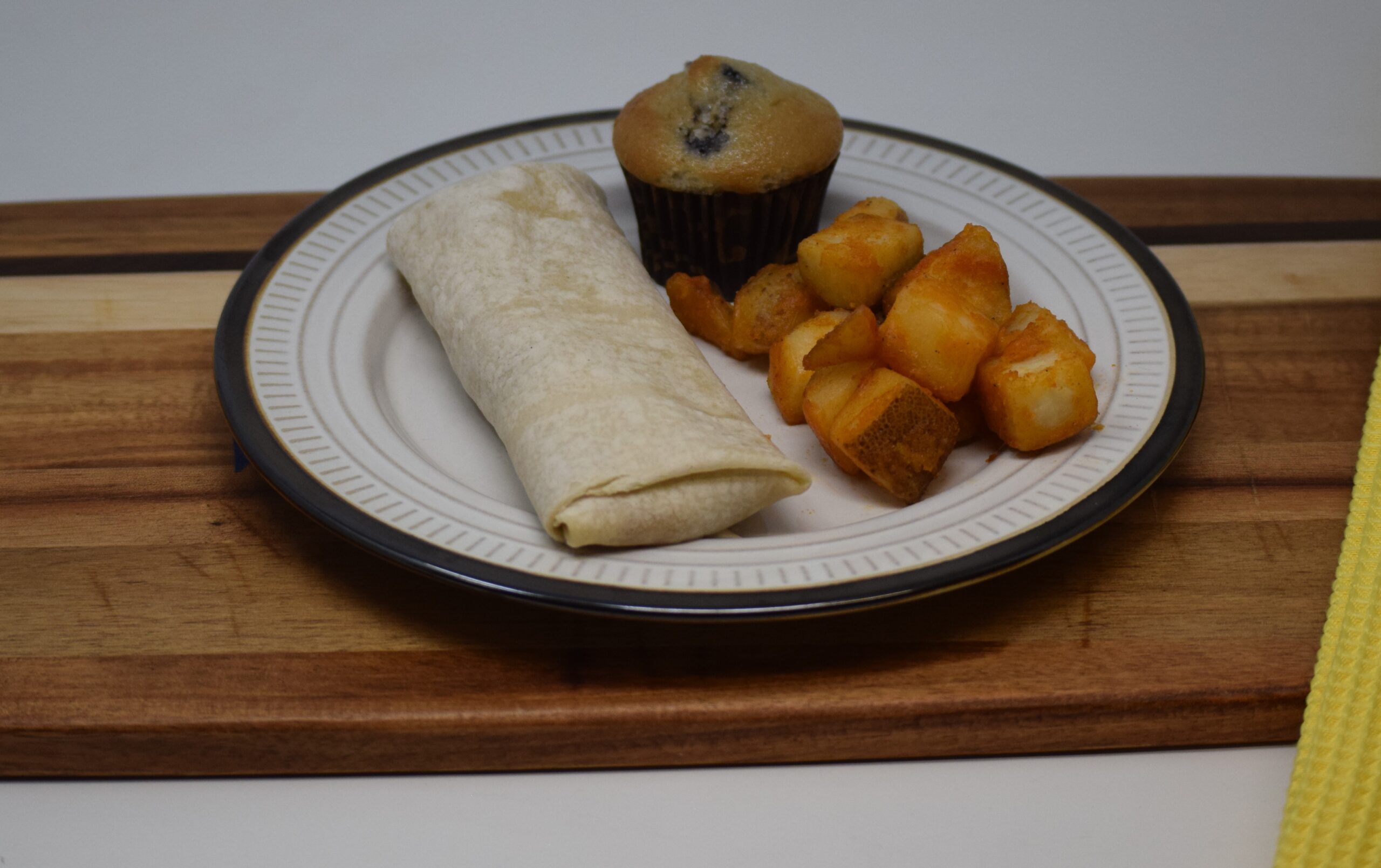#20 - Breakfast Burrito, Seasoned Potatoes, 1 Mini Blueberry Muffin